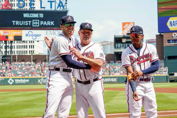 After Atlanta tabbed Snitker as interim manager in 2016, Freeman (left) pushed for his full-time hire.